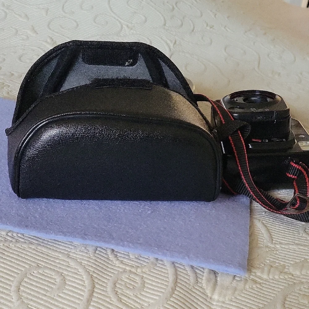 Canon Vintage Black Film Camera with Red Accents